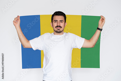 Фототапет Moustached man holding Saint Vincent And G