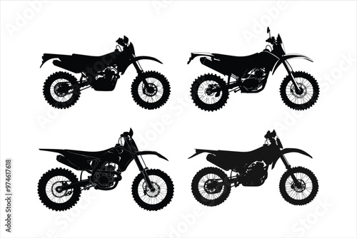 Silhouette of a motocross rider on a dirt bike.