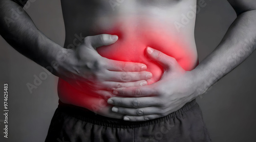 Man Holding Stomach in Pain with Highlighted Red Area, Indicating Abdominal Discomfort or Health Issue