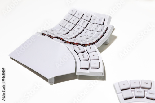 Ergonomic white split keyboard mechanic on an isolated background