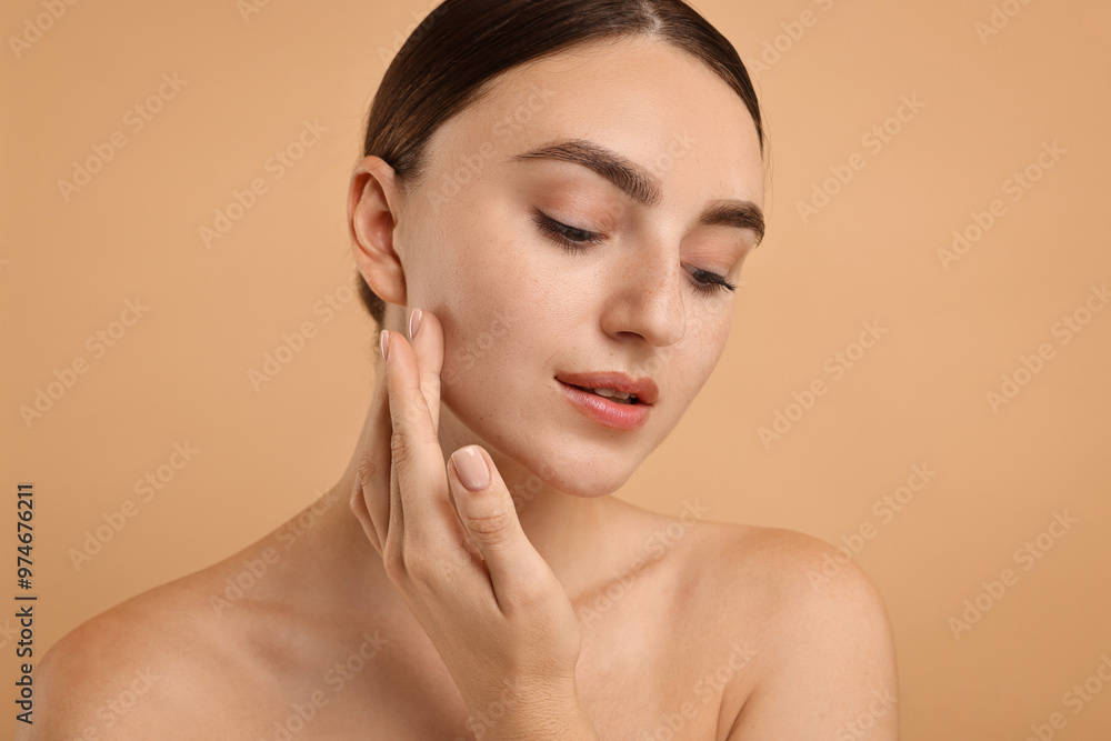 Beautiful young woman with healthy skin on beige background Beautiful young woman with healthy skin on beige background
