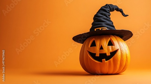 Halloween pumpkin wearing a witch's hat on orange background