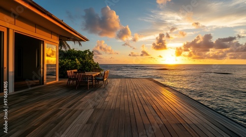 A serene sunset view from a wooden deck overlooking the ocean, perfect for relaxation.