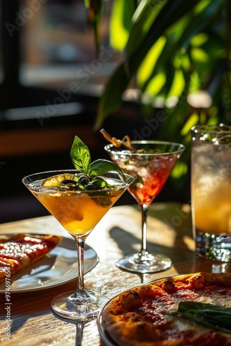Cocktails and Pizza Slices on a Table in a Sunlit Restaurant Setting