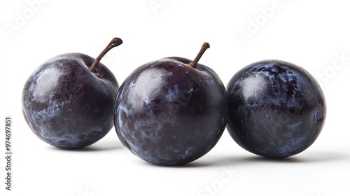 Three dark purple plums arranged closely on a white background.