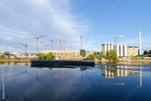 Barge on Seine river in Paris suburb. Ivry-sur-Seine city