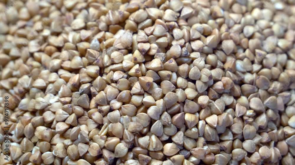 A mass of buckwheat groats, creating a textured and visually appealing pattern. A mass of buckwheat groats, creating a textured and visually appealing pattern.