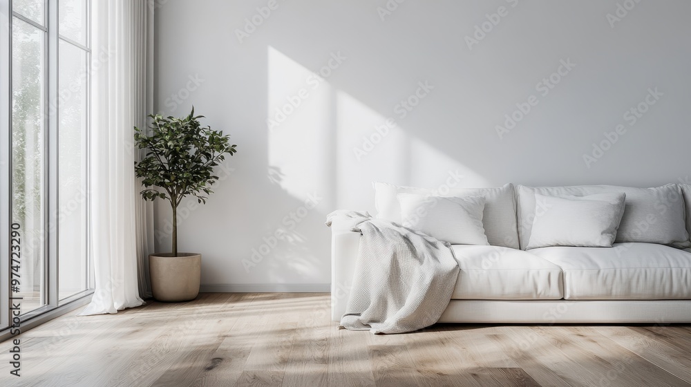 A well-lighted room featuring a white sofa and a potted plant placed beside a large window. The decor is simple yet elegant, creating a peaceful and inviting atmosphere. A well-lighted room featuring a white sofa and a potted plant placed beside a large window. The decor is simple yet elegant, creating a peaceful and inviting atmosphere.