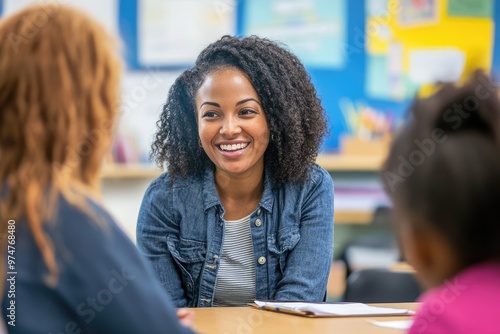 Elementary school teacher smiling during parent teacher meeting