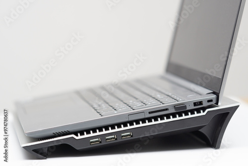 Opened laptop on cooling stand