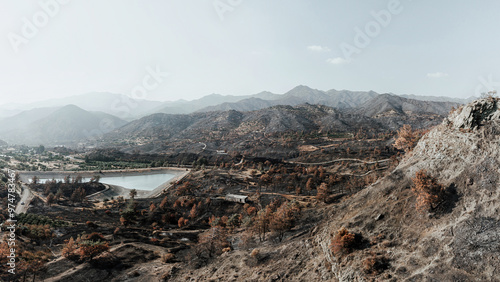 Bild auf Leinwand Water reservoir surviving a devastating forest fire near Arakapas village