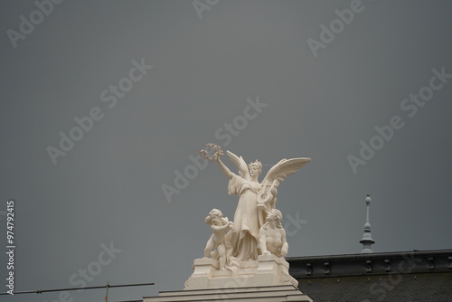 Stadttheater or Opera house in the Swiss city of Zuerich at Sechselautenplatz. Angel sculptures. photo