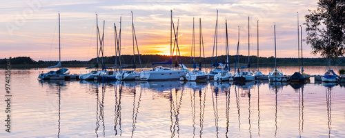 Summer landscape of Lake Rothsee with littel harbor during sunset near Nuremberg in Bavaria in Germany