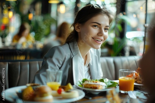 A woman sits at a table enjoying her meal