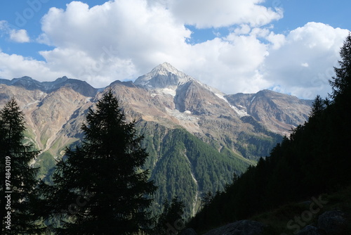 Wallpaper Mural Snow capped peak of Bietschhorn as seen from the Lötschberg Panoramaweg hiking tour in Switzerland, on a sunny, partially cloudy day. Torontodigital.ca