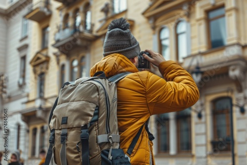 A person captures the scene of an urban landmark on camera