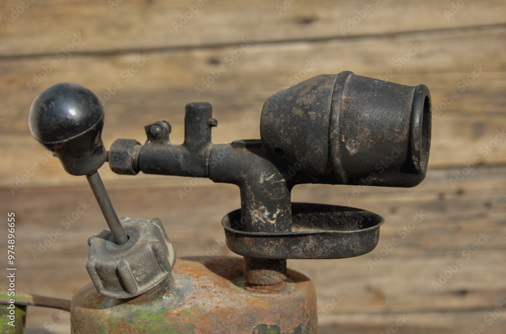 old gasoline blowtorch close up. selective focus old gasoline blowtorch close up. selective focus