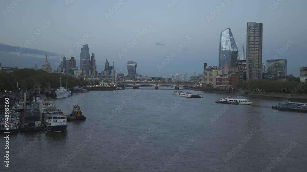 An overlook of the London city with the Thames River after the sunset. An overlook of the London city with the Thames River after the sunset.
