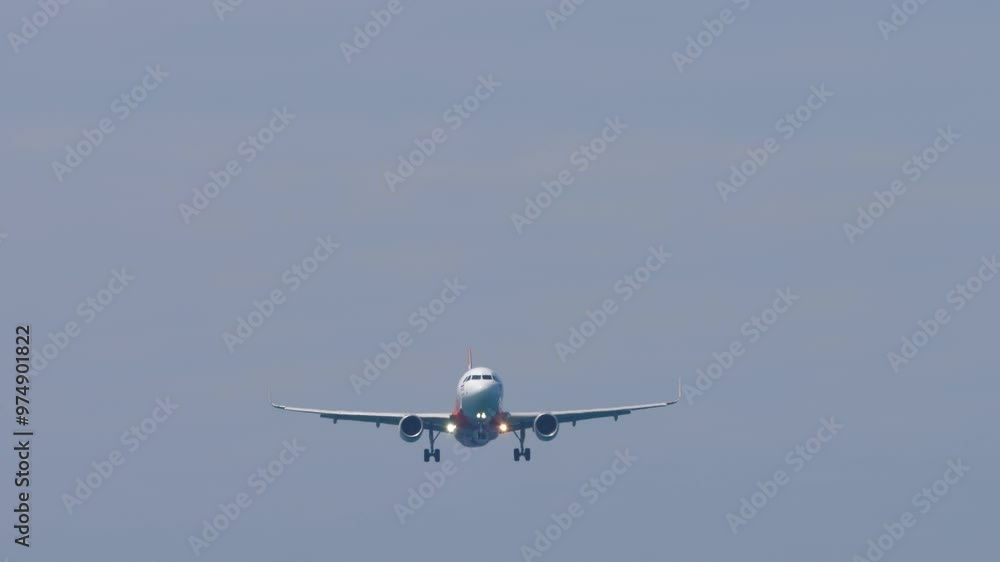 Jet passenger plane descending before landing, view from below. Airliner in the sky. Travel concept. Spotting Jet passenger plane descending before landing, view from below. Airliner in the sky. Travel concept. Spotting