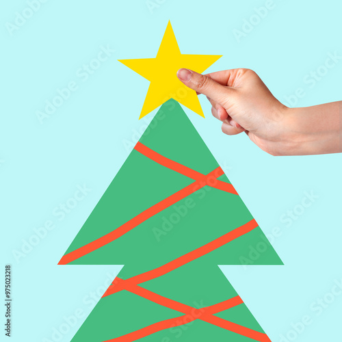 Contemporary art collage, hands placing star and yoys on minimalist christmas tree, isolated. Minimal abstract picture. Concept of winter holidays, New Year, festive mood, celebration. Greeting card photo