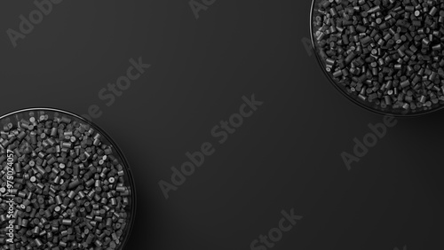 Cuadro en lienzo Top view on two glass cups with black plastic polypropylene granules, masterbatch polymer grain, on black backdrop
