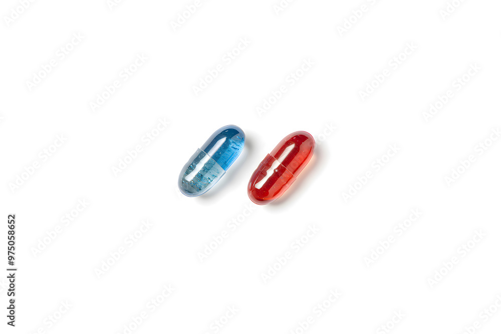 Red and blue capsules on a white background. Choice concept. Design template for advertising vitamins, medicines, healthy lifestyle, microelements copyspace Red and blue capsules on a white background. Choice concept. Design template for advertising vitamins, medicines, healthy lifestyle, microelements copyspace