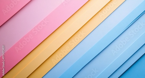 Colorful paper strips arranged diagonally in pastel hues across a flat surface