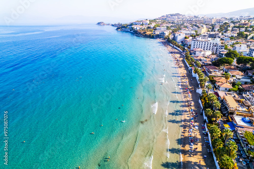 Fototapeta Naklejka Na Ścianę i Meble -  Kusadasi, Aydin, Turkey. Ladies Beach (Turkish: Kadinlar Denizi) in Kusadasi. Touristic beach resort town on Turkey. Aerial view of Kusadasi.
