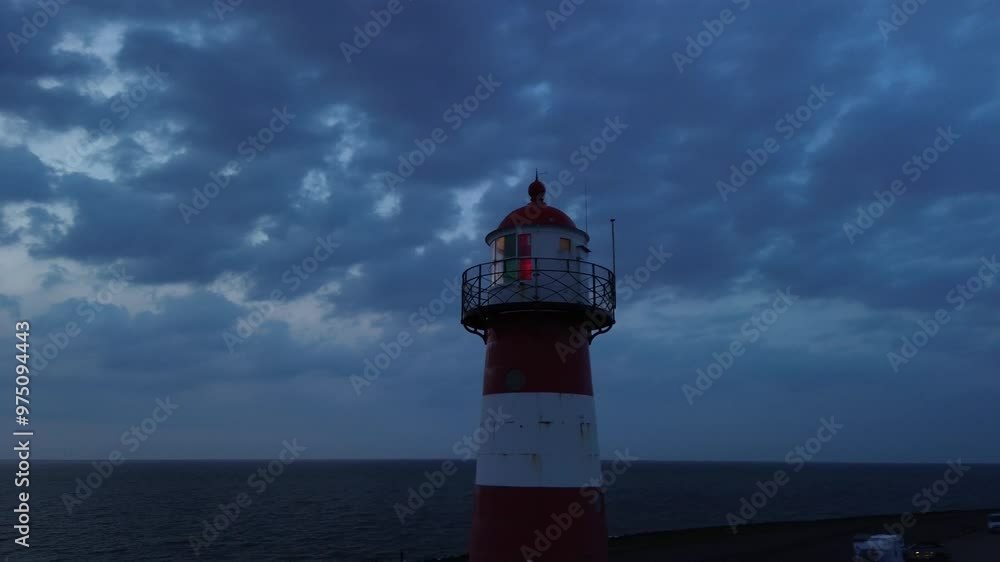 Drone cinematic 4K view on a Peaceful and Tranquil Evening at a Lighthouse Under a Dramatic Cloudy Sky and Horizon Drone cinematic 4K view on a Peaceful and Tranquil Evening at a Lighthouse Under a Dramatic Cloudy Sky and Horizon