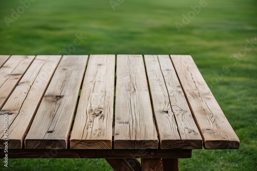 Rustic Wooden Table Against a Green Background in an Outdoor Setting