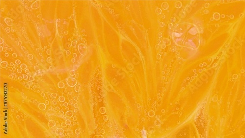 Slice an orange in bubble water. Slice of orange in carbonated water. Party concept, summer, holiday, birthday