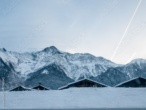 Εκτύπωση καμβά Snow-covered rooftops in Chamonix, France with majestic mountains during winter