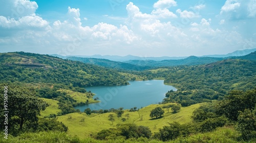 Beautiful scenic overlook with a panoramic view of rolling hills and a crystal-clear lake, surrounded by lush greenery, perfect for travel and exploration