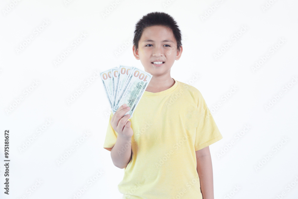 Photo of funny adorable cheerful boy wear stylish yellow clothes hold money empty space isolated on white color background Photo of funny adorable cheerful boy wear stylish yellow clothes hold money empty space isolated on white color background
