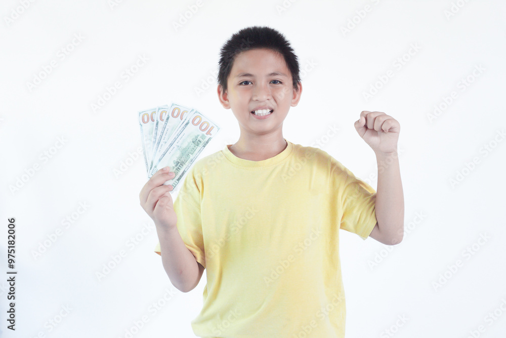 Photo of funny adorable cheerful boy wear stylish yellow clothes hold money empty space isolated on white color background Photo of funny adorable cheerful boy wear stylish yellow clothes hold money empty space isolated on white color background