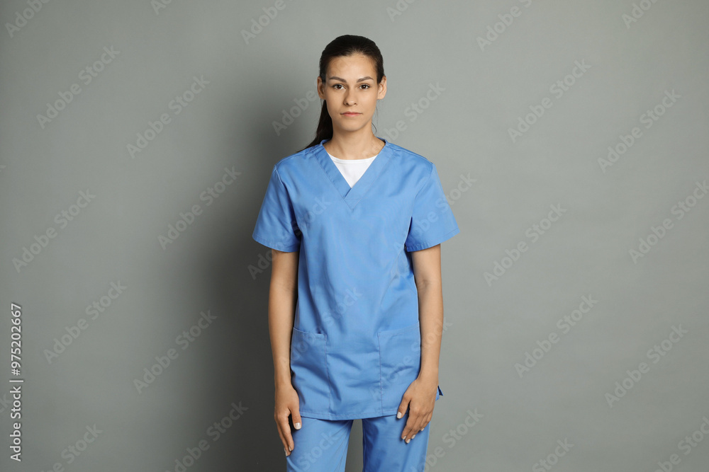 Portrait of beautiful nurse on grey background Portrait of beautiful nurse on grey background