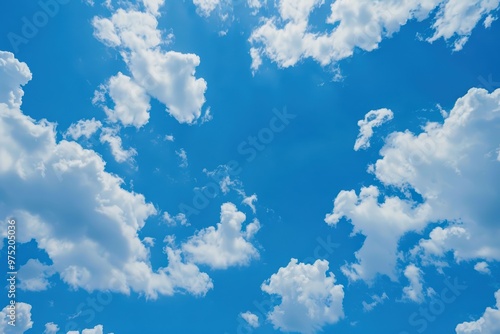 Scenic view of blue sky with fluffy white clouds