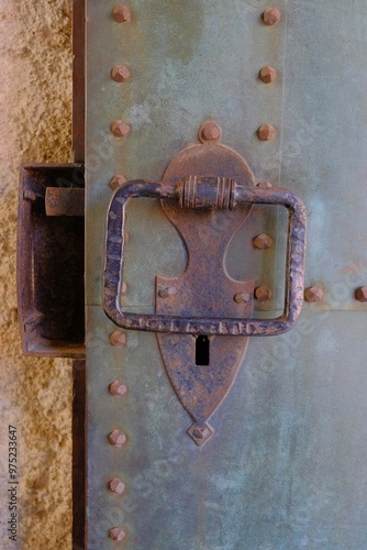 Rusty door handle and lock on ancient castle in Bled, Slovenia