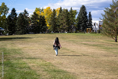 person walking in field photo