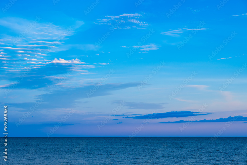 Obraz premium Nature of the beach and sea Summer with sunshine, sandy beaches, clear blue waters sparkling against the blue sky. On an island with good ecology and environment Background for summer vacation concept