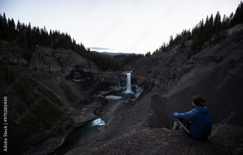 Fototapeta premium person watching the waterfall