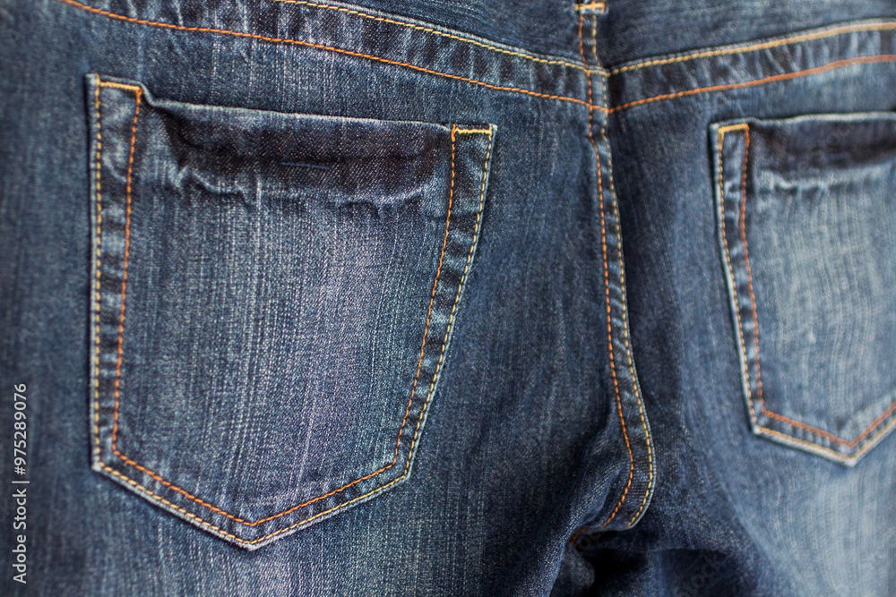 Close-up of back pockets on dark blue jeans Close-up of back pockets on dark blue jeans