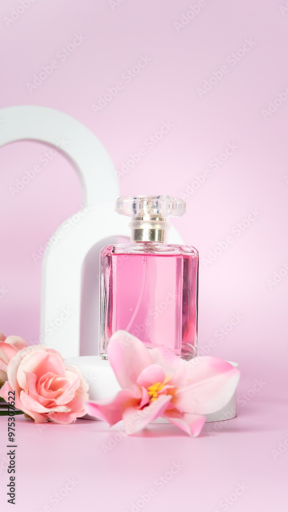 Transparent bottle of perfume on a pink background. Fragrance presentation with daylight. Trending concept in natural materials with window shadow. Perfume sweet pink roses template for advertising. Transparent bottle of perfume on a pink background. Fragrance presentation with daylight. Trending concept in natural materials with window shadow. Perfume sweet pink roses template for advertising.
