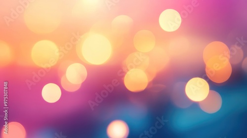 Abstract background with blurred out-of-focus bokeh lights in pink, yellow, and blue.
