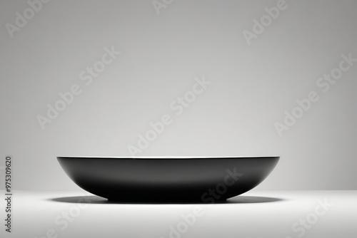 a black bowl sitting on top of a table 