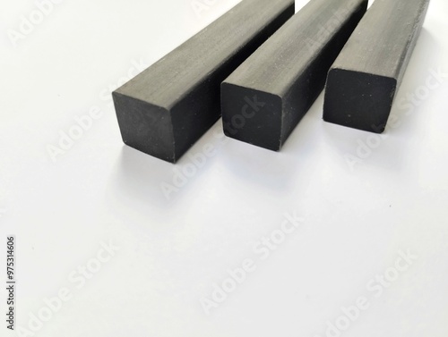 black eraser made of synthetic rubber or natural rubber on a white background photo