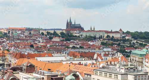 View of St Vitus Cathedral and old town from observation platform of Old Town Hall in old part of Prague in Czech Republic