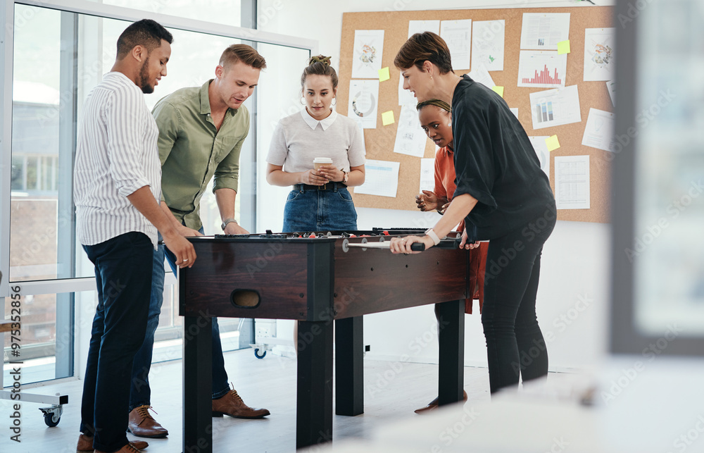 Happy people, foosball or playing with game for team building or bonding together at office. Young, group or employees enjoying fun competition, board challenge or football entertainment at workplace Happy people, foosball or playing with game for team building or bonding together at office. Young, group or employees enjoying fun competition, board challenge or football entertainment at workplace