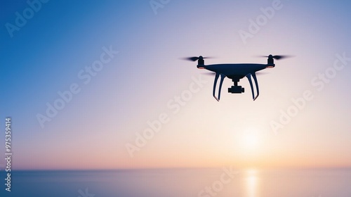 Drone flying over calm sea at sunset