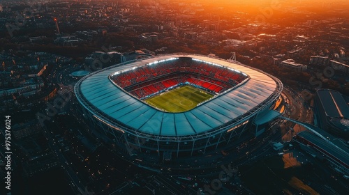 Aerial perspective of Wembley Stadium concert at dusk, the stadium glowing against the soft, fading light of sunset in London.
